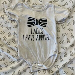 Chic White and Black Bodysuit with Bow Design